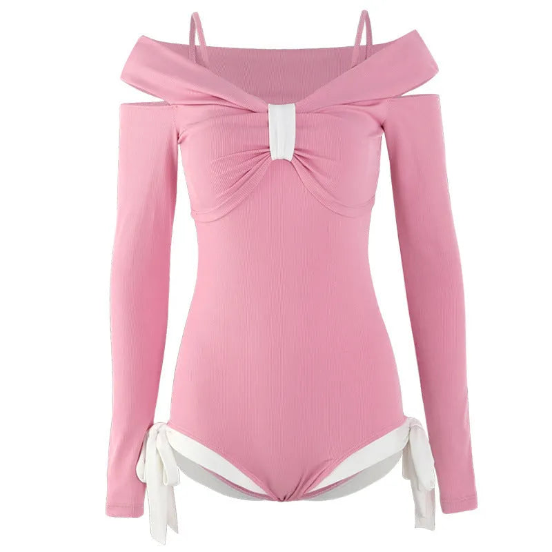 Women's long-sleeve one-piece swimsuit in black or pink colour with polyester construction