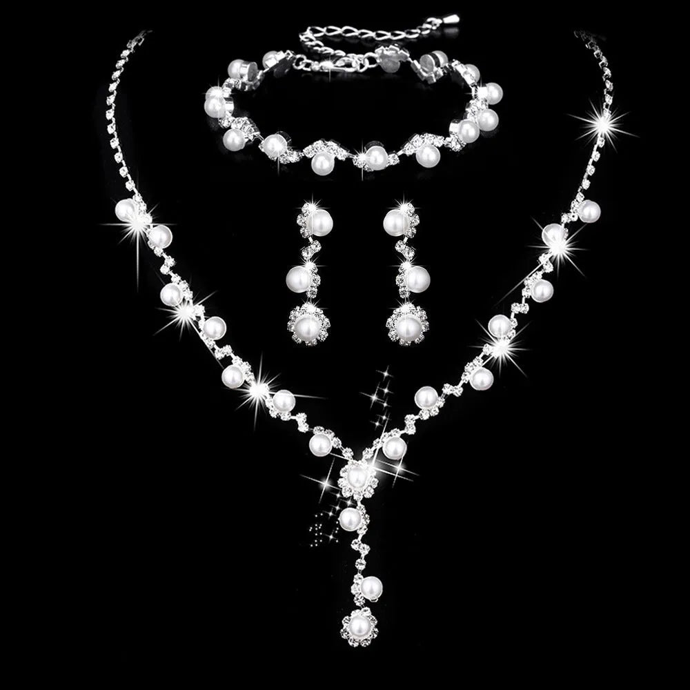Fashion crystal rhinestone jewellery set including necklace earrings bracelet with pearl elements and bamboo chain design