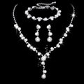 Fashion crystal rhinestone jewellery set including necklace earrings bracelet with pearl elements and bamboo chain design