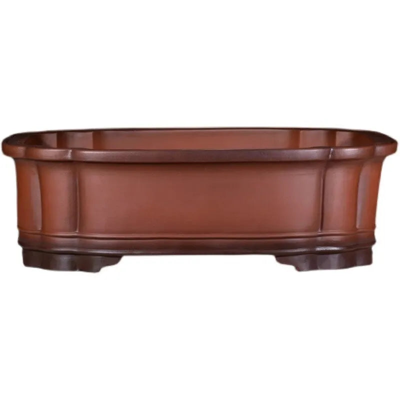 Large antique-style purple clay Chinese flower pot showing wide, shallow shape.