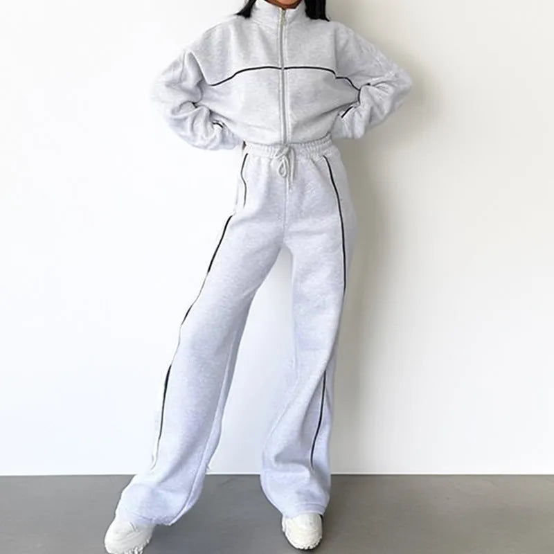 Casual polyester suit with zip hoodie and striped lace-up trousers in apricot colour.
