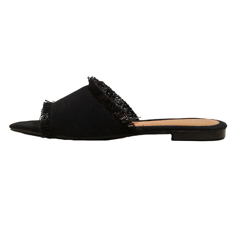 Women's denim flat slippers with tassel detail and leather lining in solid colour
