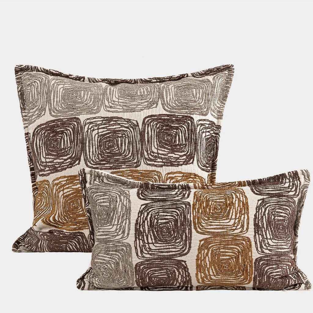 Square and waist pillow covers with cream and coffee abstract coil pattern