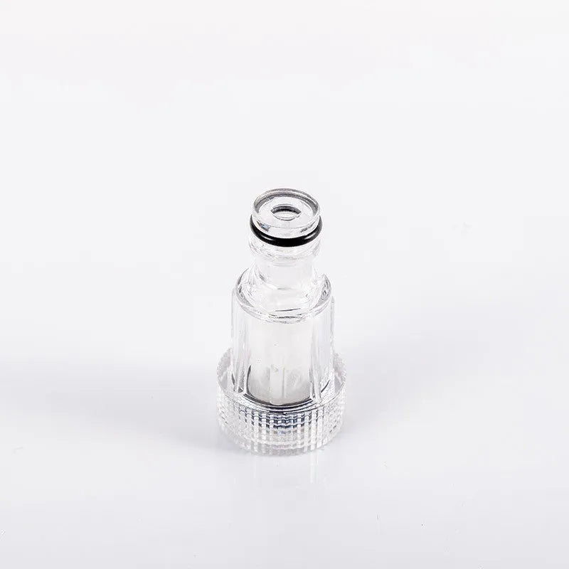 Clear plastic Karcher pressure washer inlet joint with 3cm diameter, shown alongside a machine.