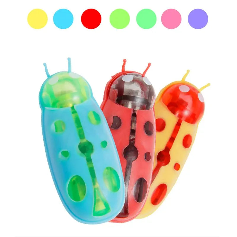 Mini electric bug pet toy showing ladybug design with motorised walking movement on flat surface
