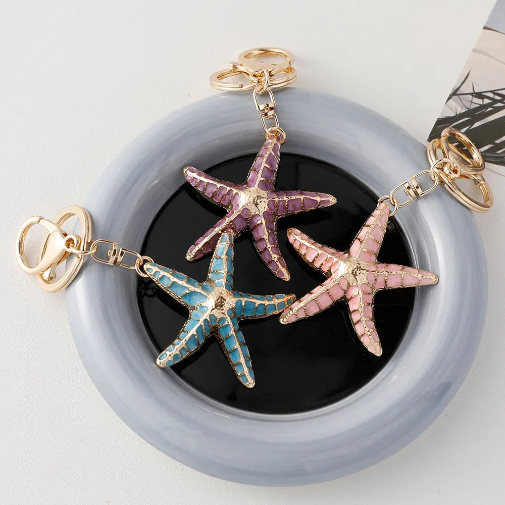 Ocean Series starfish shell keychain with electroplated finish in blue pink and purple colours