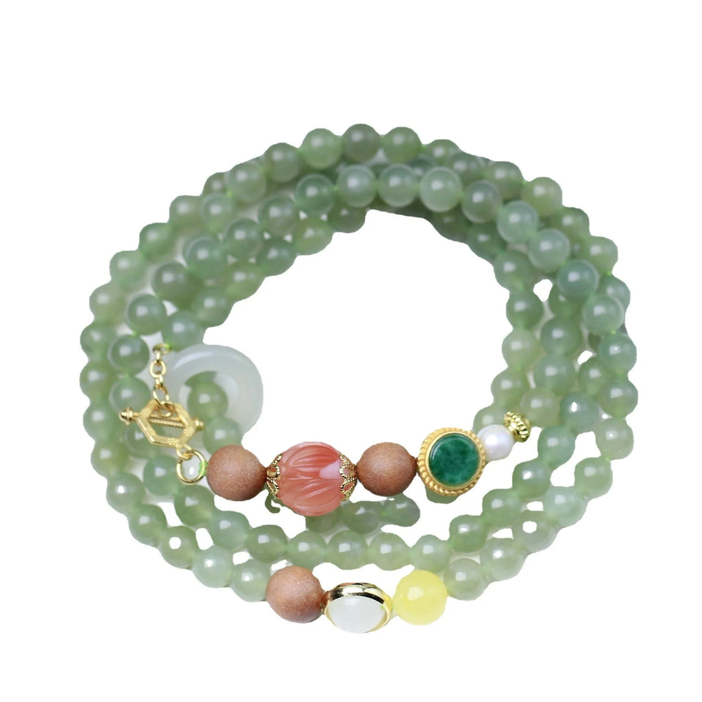 Natural Hetian jade necklace with red lotus beads, white sandalwood, and beeswax accents; unisex design with fu character motif