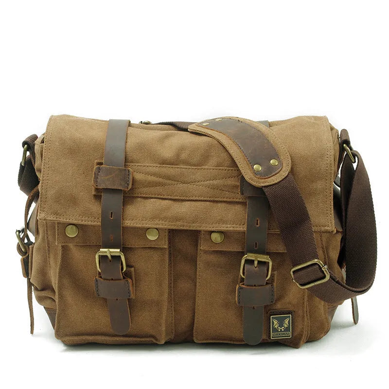Men's canvas crossbody shoulder bag with cowhide trim showing internal organisers