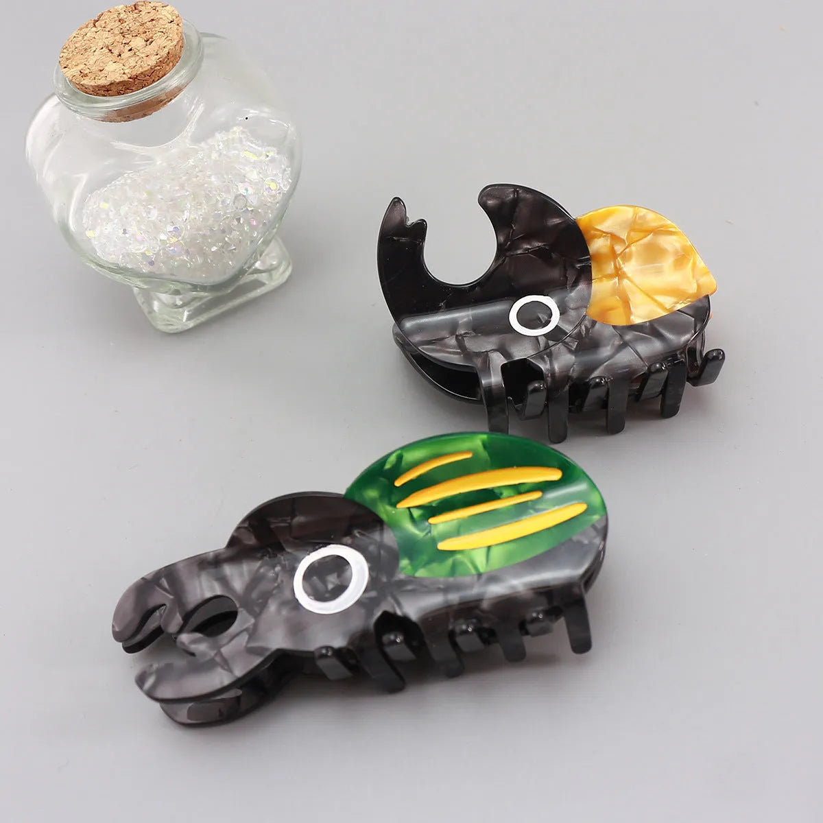 Cellulose acetate beetle grip with insect biology design in green, orange, or white colour options