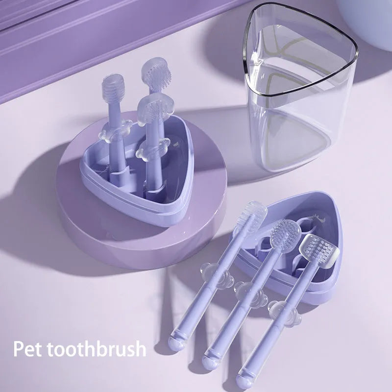 Blue, green, and purple dual-head silicone toothbrushes for pet dental care on a white background.
