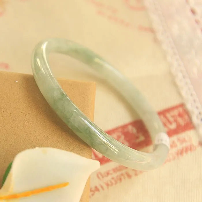 Green jade geometric bracelet with waxy finish, 10mm diameter, Chinese-style design