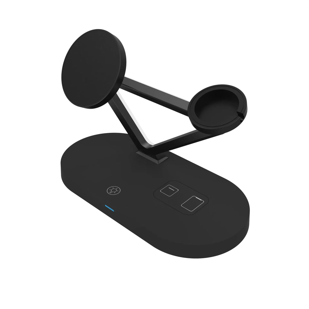 White 5-in-1 magnetic wireless charging desktop stand with small lamp for iPhone, Apple Watch, and Airpods on a desk
