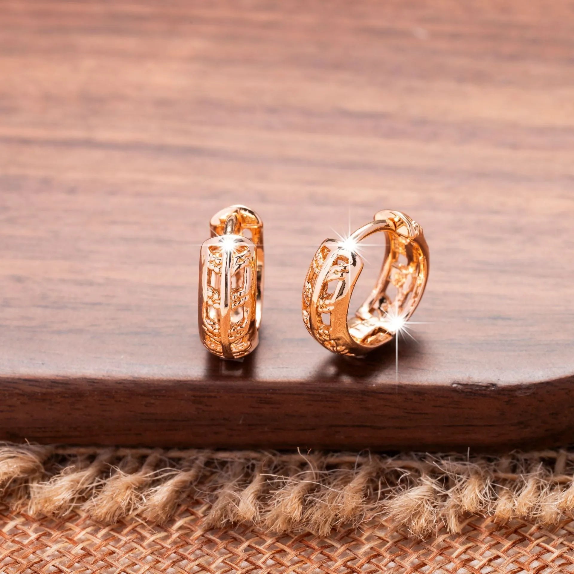 Copper earrings with rose gold finish featuring hollowed-out leaf and heart shapes