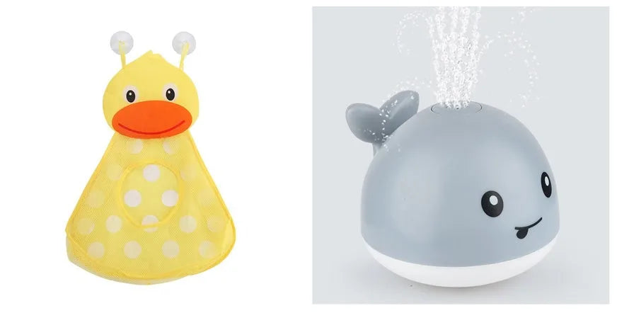 Electric whale bath toy with automatic water spray and flashing lights on a base