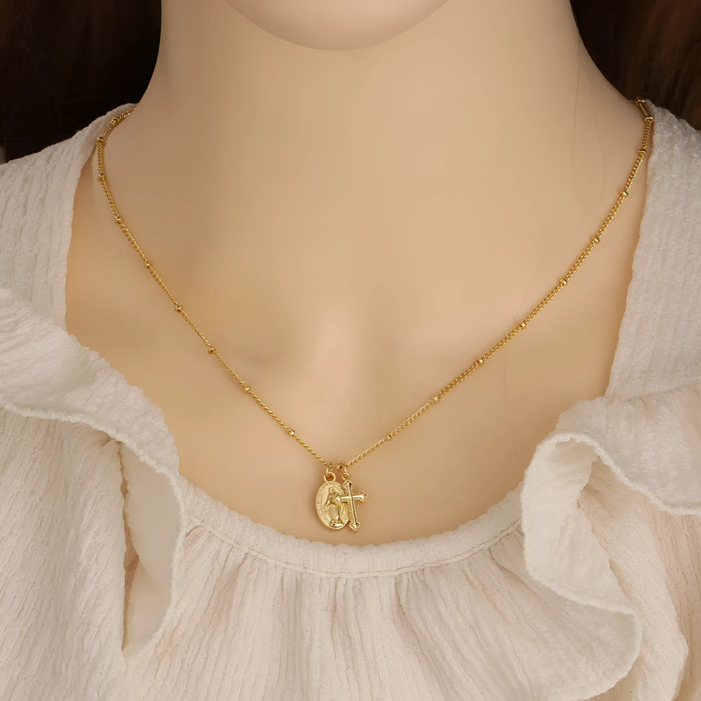 Gold cross pendant necklace with Virgin Mary ornament on geometric 2.5 cm pendant