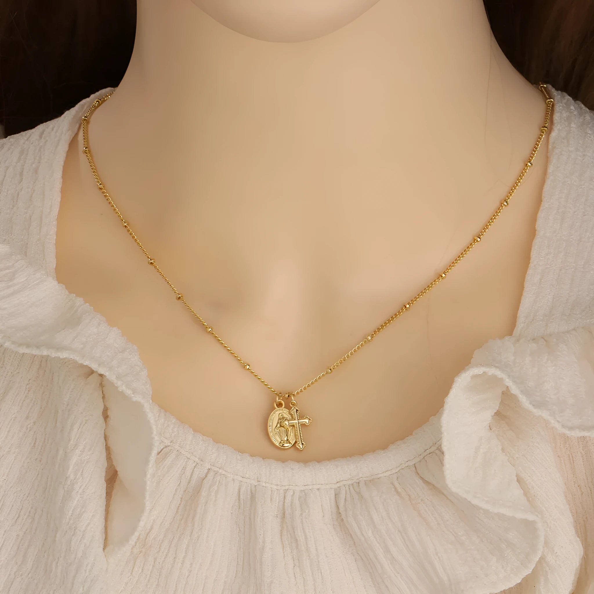 Gold cross pendant necklace with Virgin Mary ornament on geometric 2.5 cm pendant