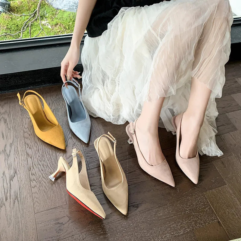 Women's pink suede pointed-toe stiletto high heels on a plain background