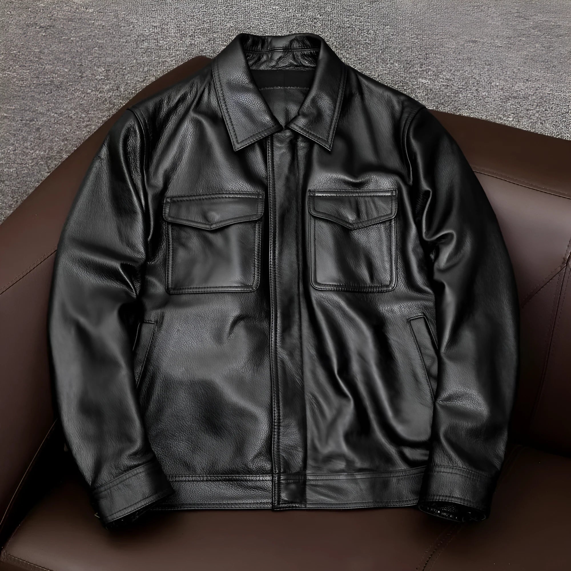 Men's black loose-fit PU leather jacket with lapel collar and side pockets for plus-size frames.