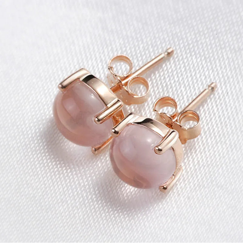 Women's rose gold Korean style drop shaped stud earrings with synthetic ross quartz crystal inlay