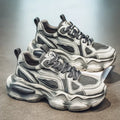 Men's black, grey, or white mesh sneakers with platform sole and lace-up front.