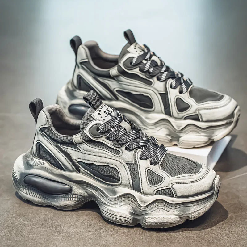 Men's black, grey, or white mesh sneakers with platform sole and lace-up front.