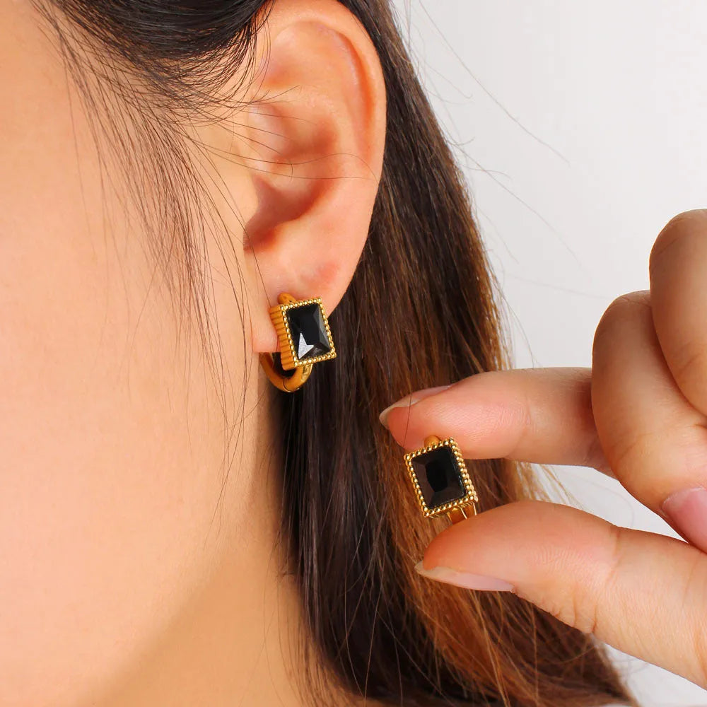 Stainless steel earrings with square zircon stones in geometric design with round ring elements