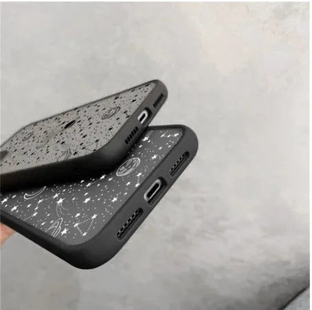 Black and white iPhone cases with soft touch surface showing raised edge protection