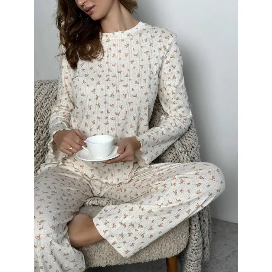 Women's white floral print pyjama set with bell sleeve top and wide-leg trousers
