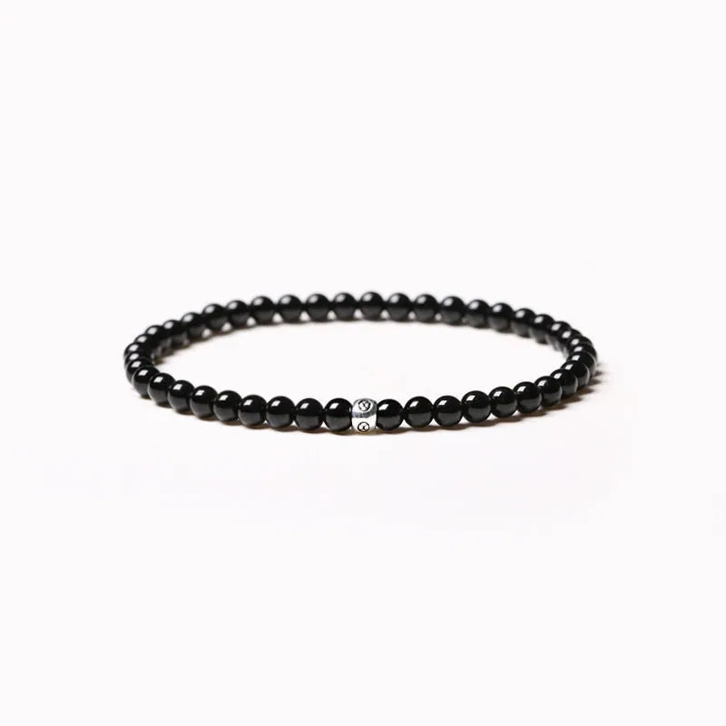 Unisex geometric bracelet with obsidian, blue San, and black agate beads.