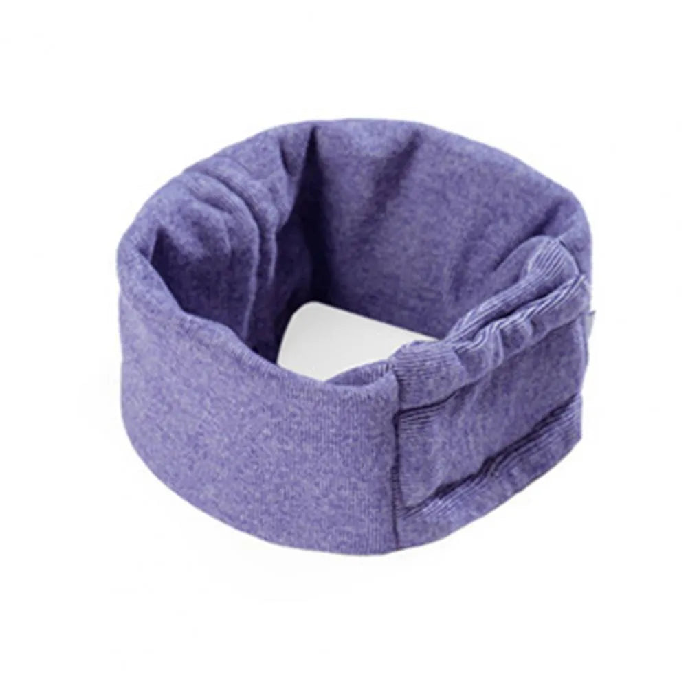 Dog wearing black calming hoodie head cover with ear wraps for noise reduction and anxiety relief