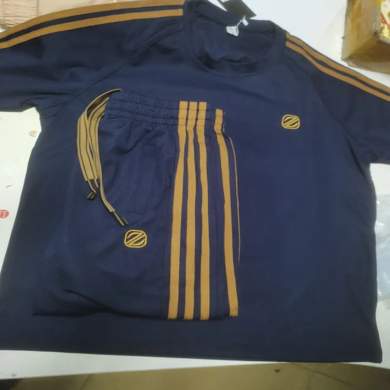 Men's blue short sleeve sports suit set with matching pants, ironing-free polyester fabric