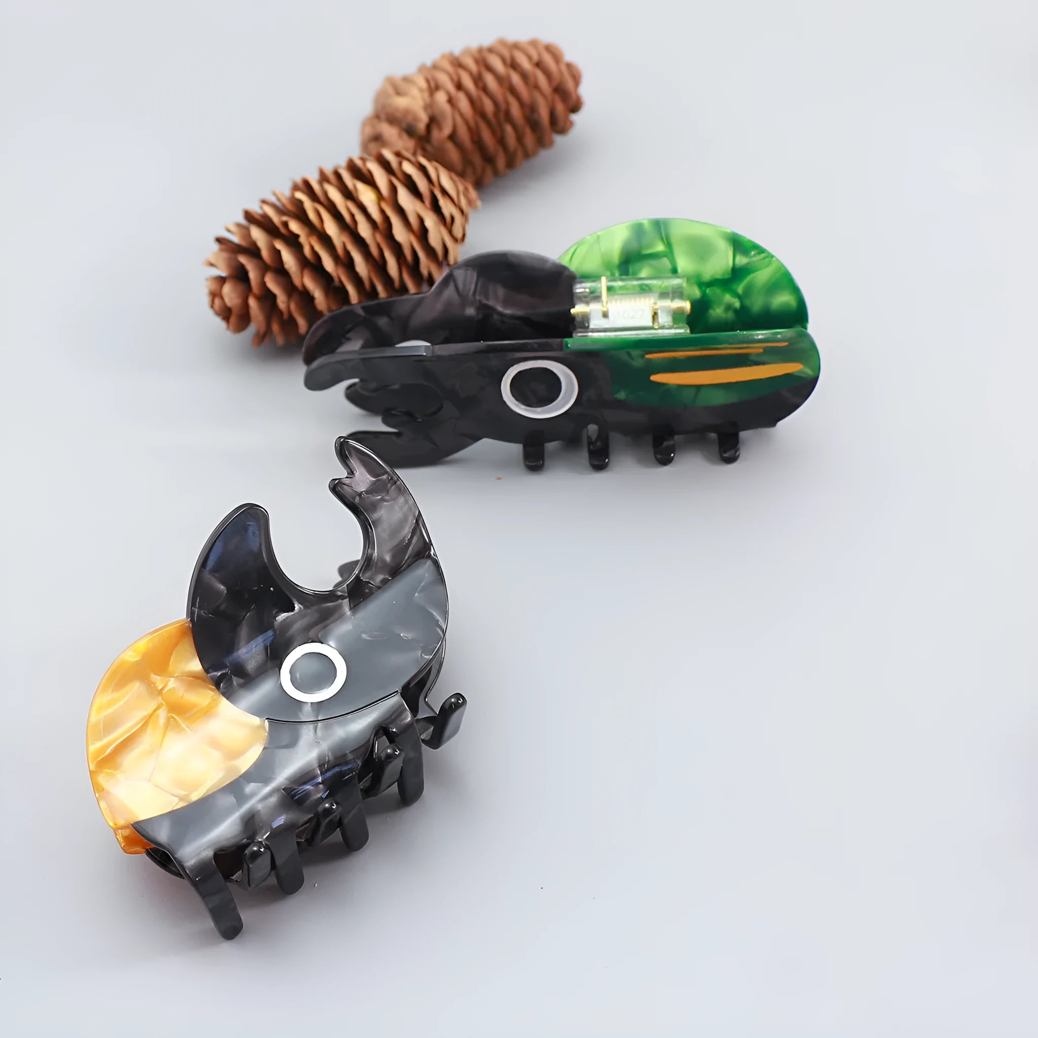 Cellulose acetate beetle grip with insect biology design in green, orange, or white colour options
