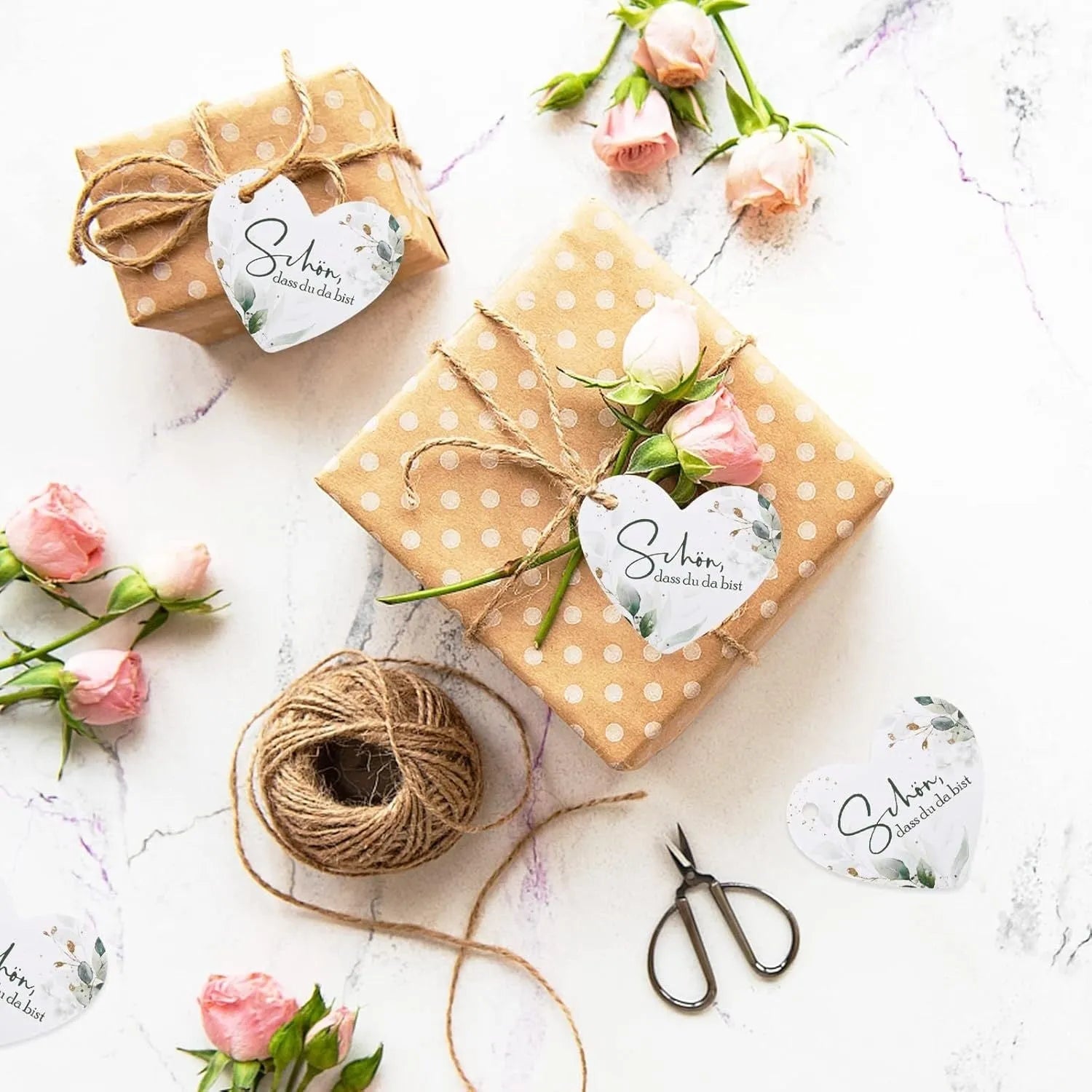 Fifty heart-shaped paper gift tags with floral design, shown in two colour style options.