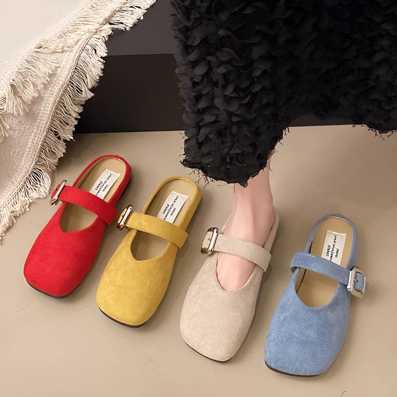 Women's flat square head slippers in apricot colour, showing closed toe and rubber sole.