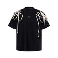 Black short-sleeved T-shirt with rivet ribbon padded shoulders and round neck in loose fit