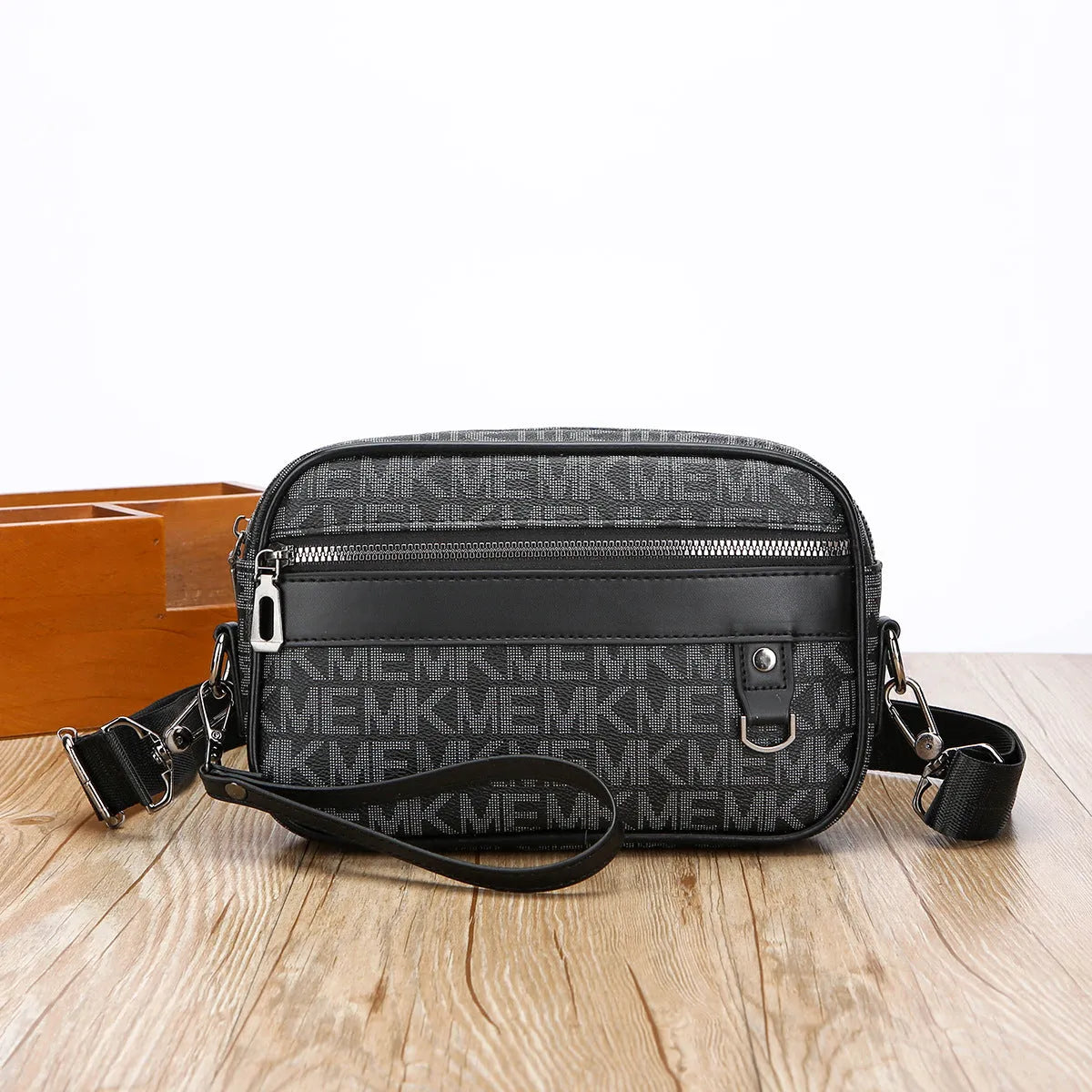 Men's black casual shoulder messenger bag with geometric pattern, shown with handheld top handle and adjustable shoulder strap.