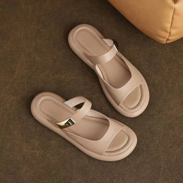 Women's apricot peep toe flat platform sandals with a rubber sole on a white background.