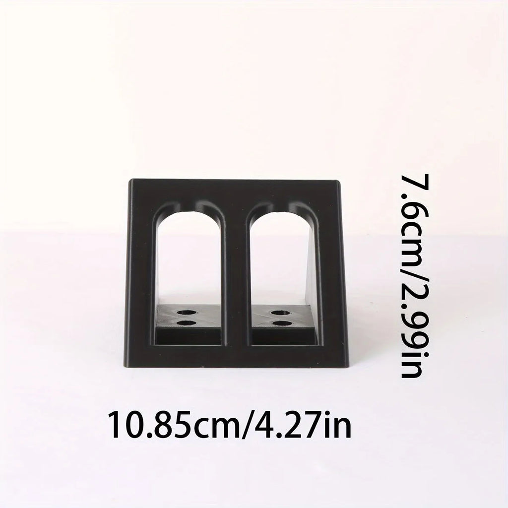 Black punk-style plastic pistol display stand for toy guns and model firearms.