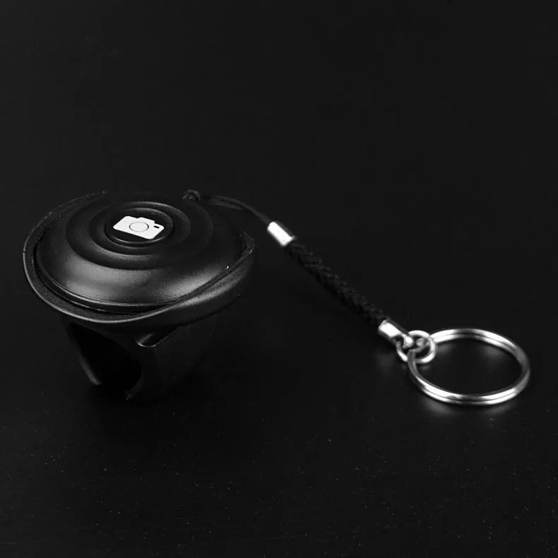 Black Bluetooth remote control for selfies with 10 metre wireless range and 27g lightweight design