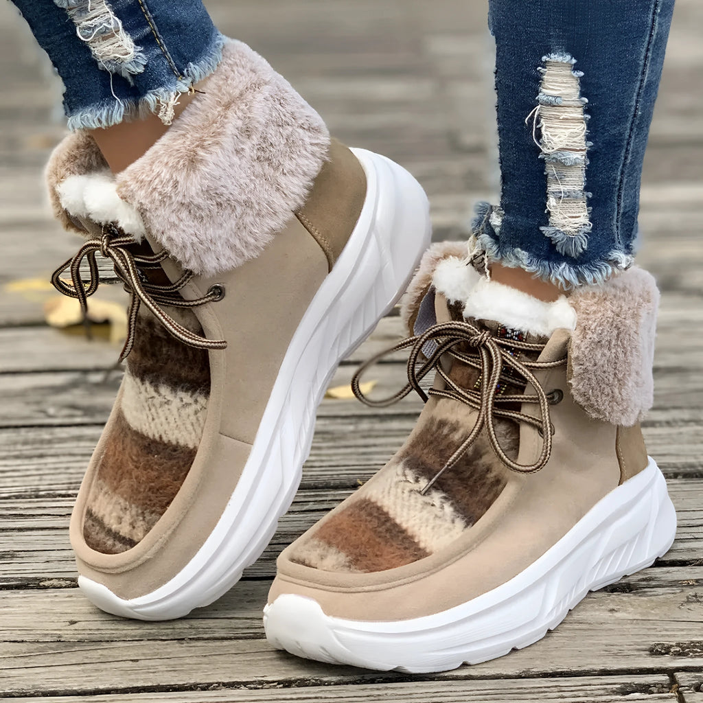 Beige women's lace-up mid-top snow boots with fuzzy lining and a thick rubber sole.