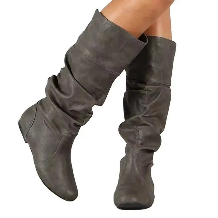 Women's black slip-on ankle boots with flat heel and round toe design