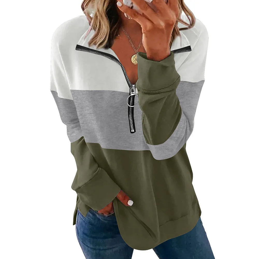 Women's loose long-sleeved leopard print polyester sweater on a hanger, showing orange and black/grey print variants.