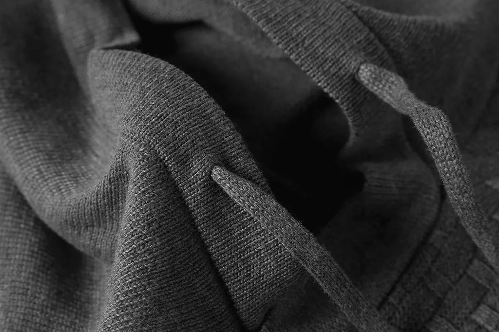 Men's black cotton-polyester blend hooded sweatshirt on a hanger
