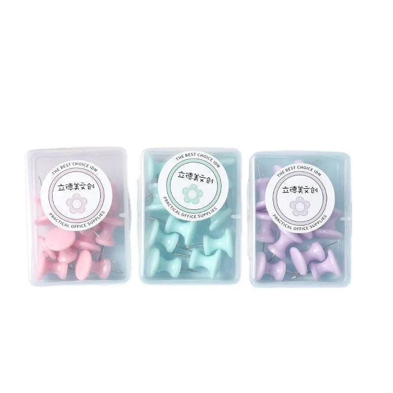 Assortment of plastic push pins in cherry blossom pink, mint green, and lavender, showing large and small sizes.