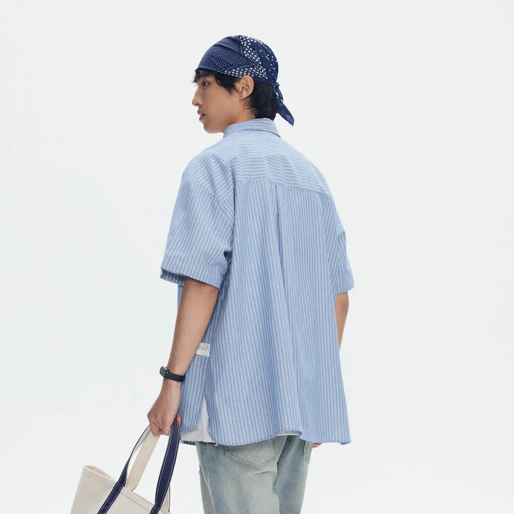 Blue striped loose-fit overalls shirt with short sleeves and cardigan style