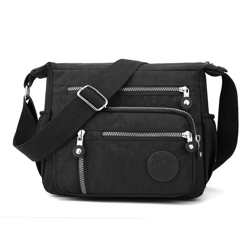 Nylon soft shoulder messenger bag in square vertical shape with single strap.