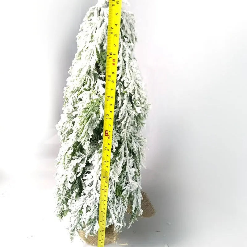 Small 24-inch desktop artificial Christmas tree with white snow sprayer effect and integrated coloured lights