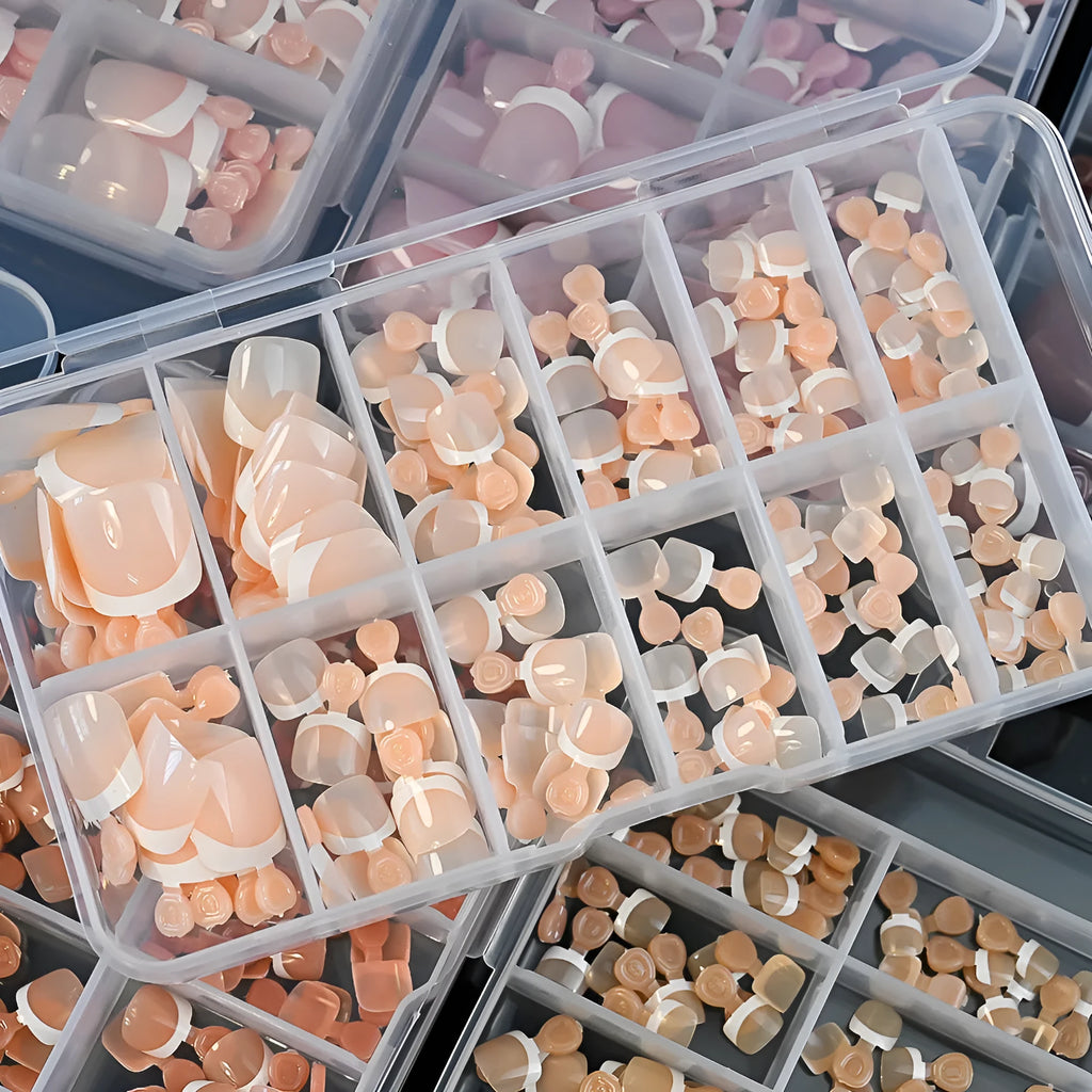 Open box showing 120 nude false toe nails with French white edges and a full-square short shape.