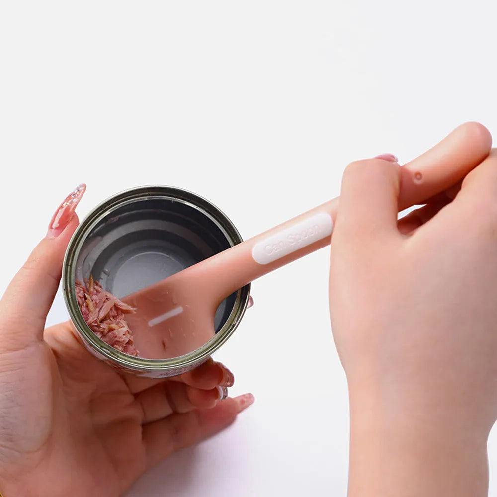 Long green pet feeding spoon with right-angle head for scooping canned dog or cat food