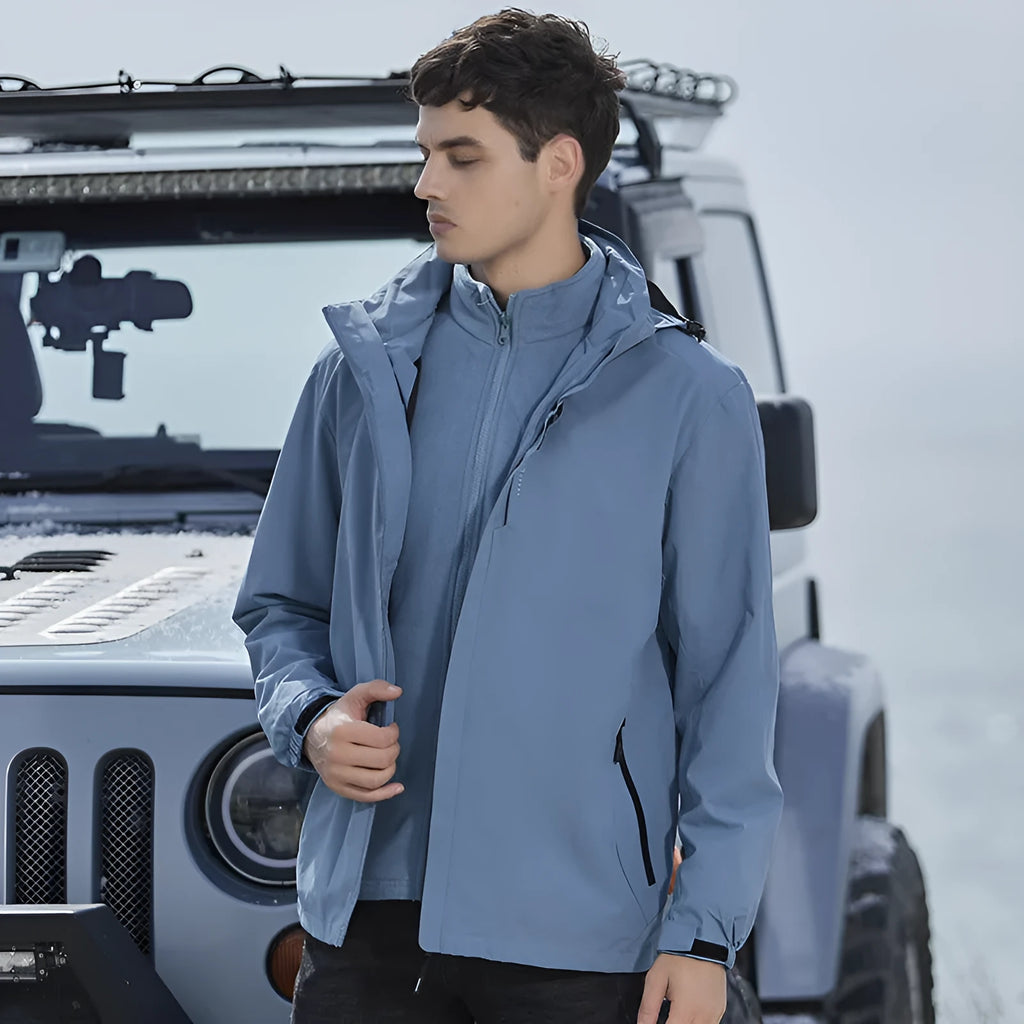 Men's fluorescent coloured two-piece waterproof mountaineering suit with polar fleece lining.